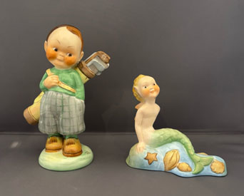 Figurines designed by Mabel Lucy Attwell, the one on the left, The Golfer (LA8), on the right, Mermaid (LA31)